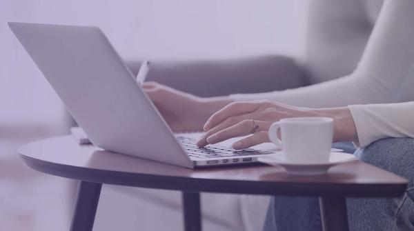 Coffee and laptop on a table