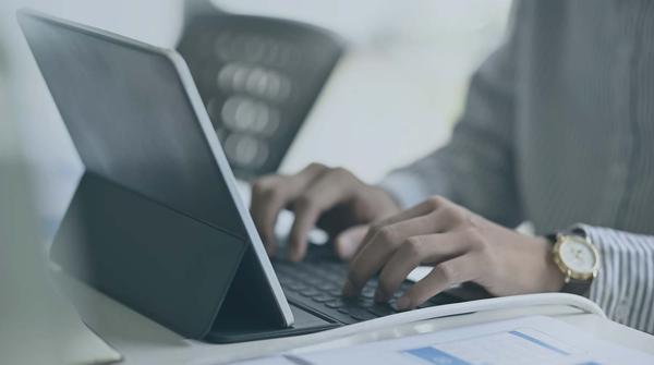 Person typing on keyboard