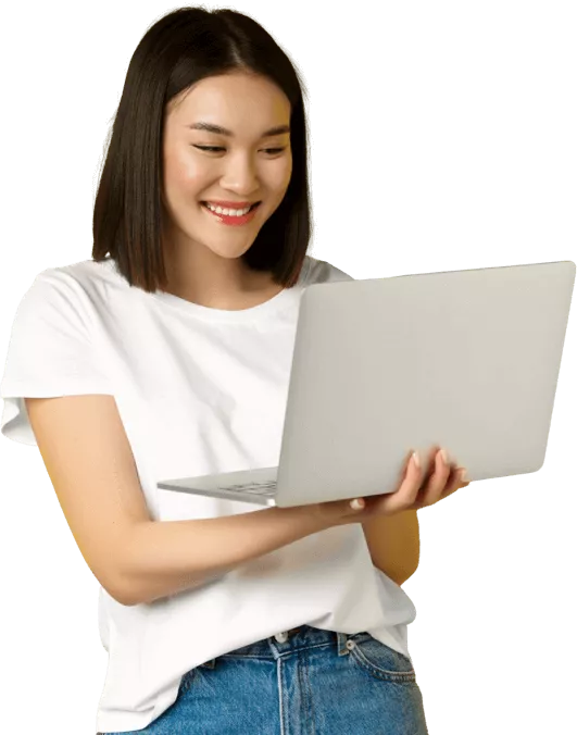 Smiling woman standing and holding an open laptop to explore cover letter formats from ResumeHelp.