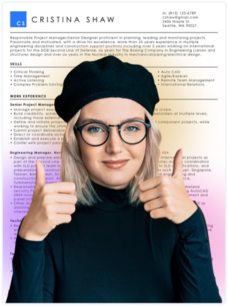 Woman holding two thumbs up with resume example in the background.